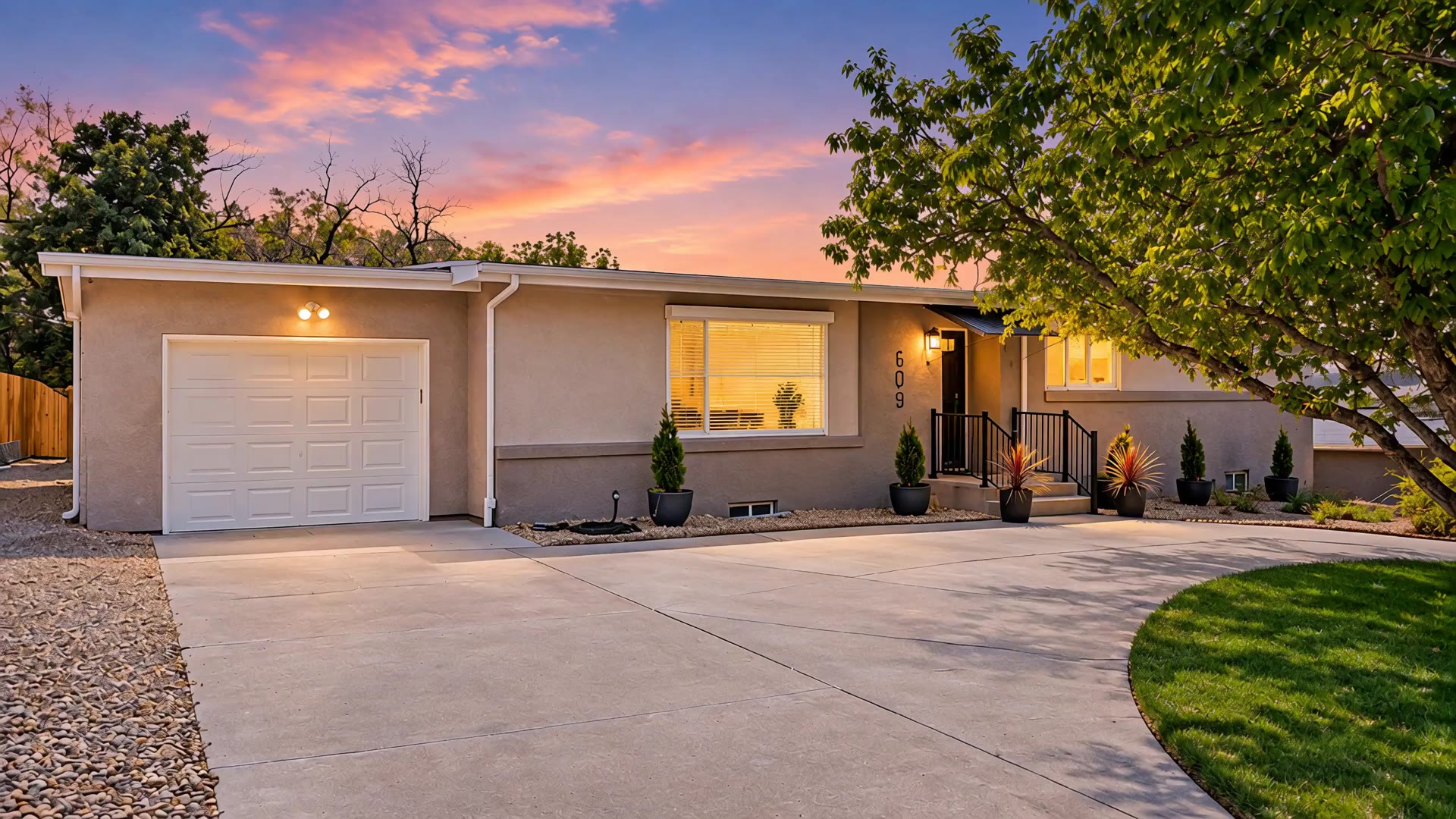 609 Crestridge Avenue at twilight, half-circle drive and lit front windows